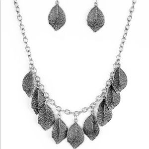 Silver necklace with dangling leaves and earrings